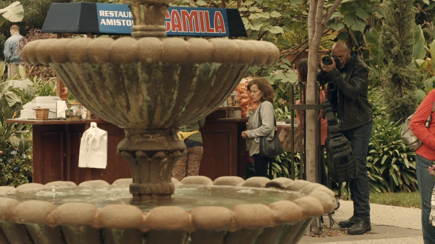 Mack snapping photos in in Spanish Plaza.