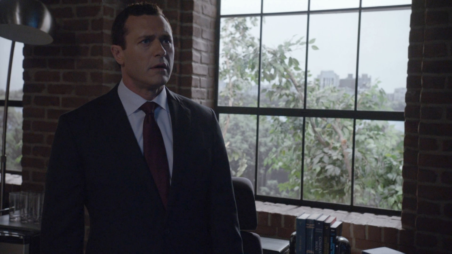 Director Mace in his SHIELD office, with a view out the window.