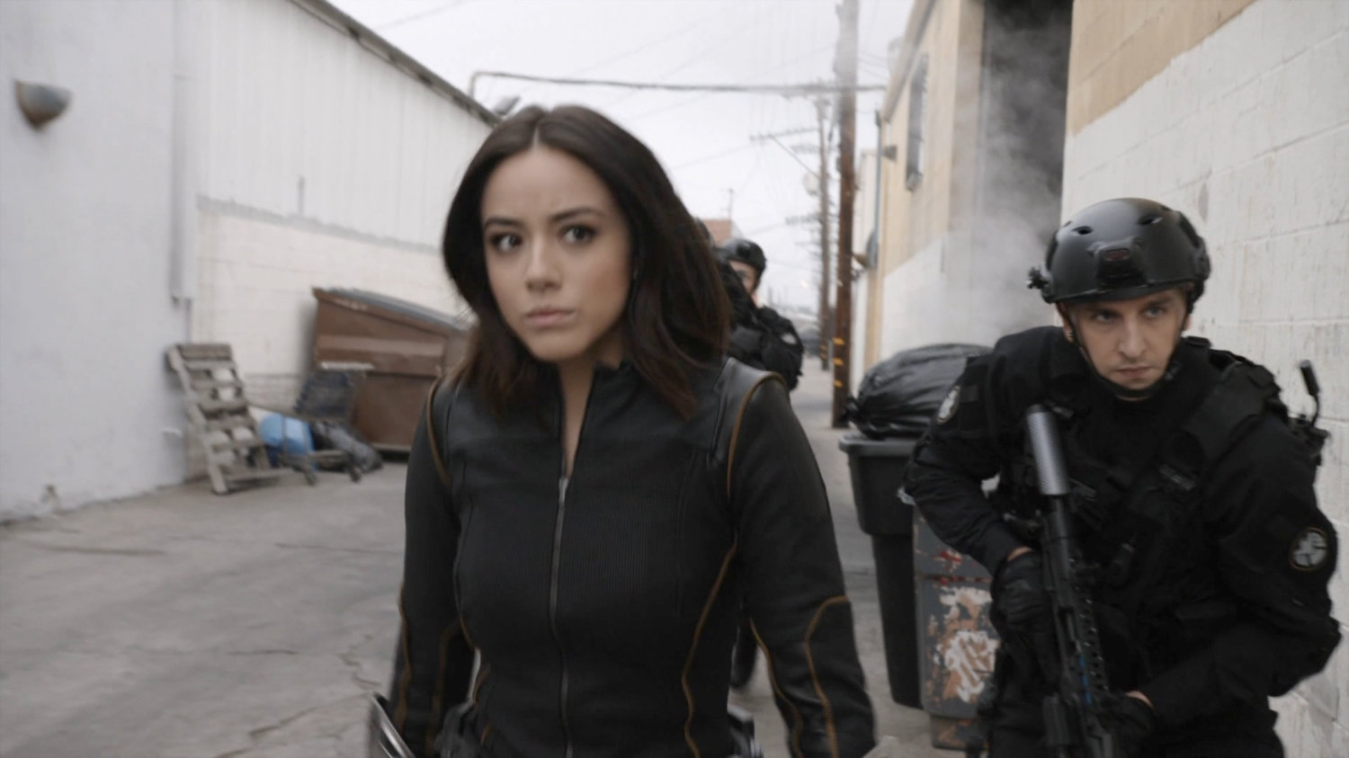 Daisy and SHIELD team in alley outside a Watchdog safehouse.