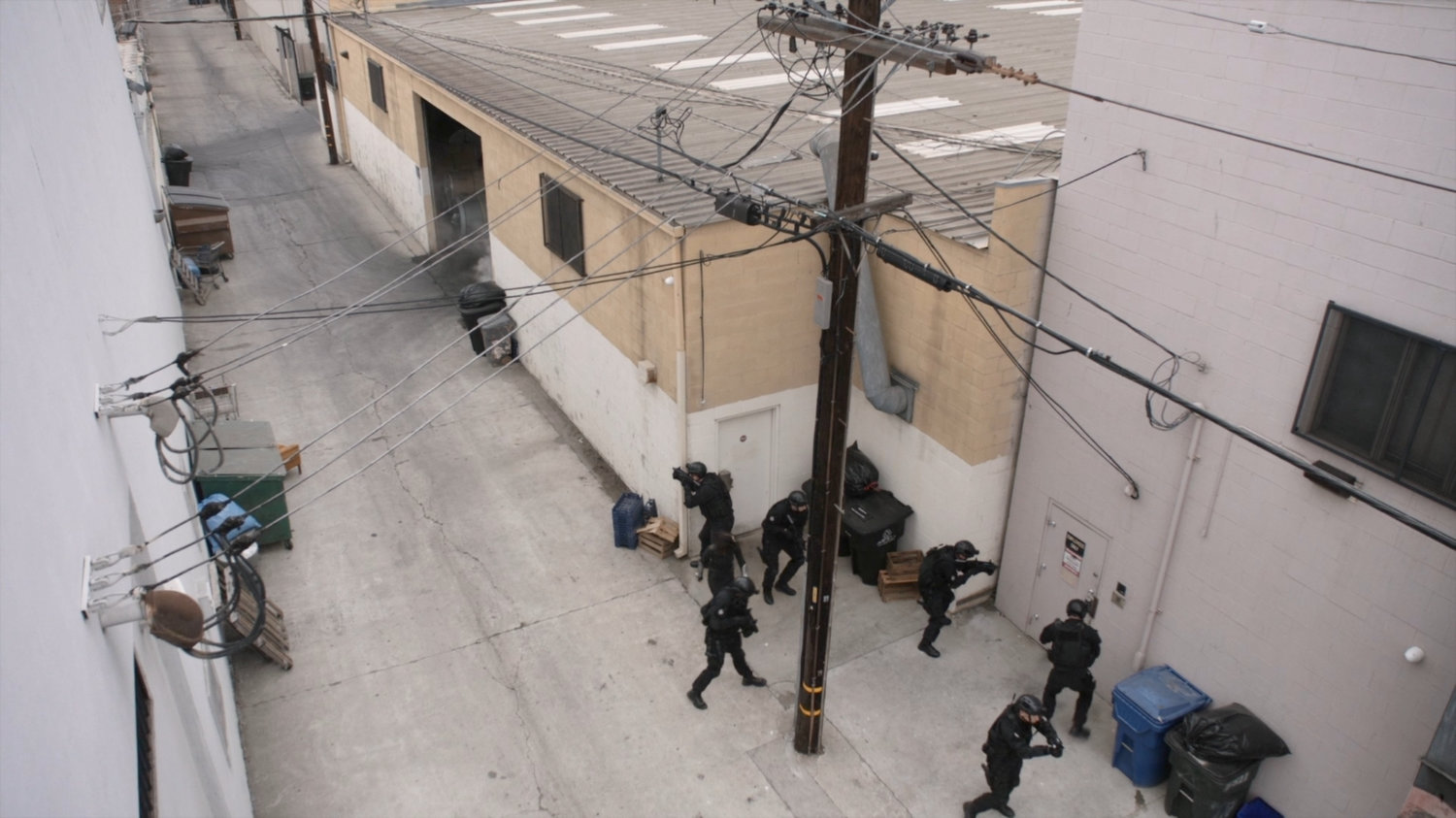 Daisy and SHIELD team in alley outside a Watchdog safehouse.