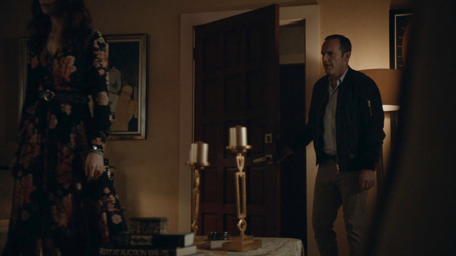 Coulson entering Agnes's apartment.