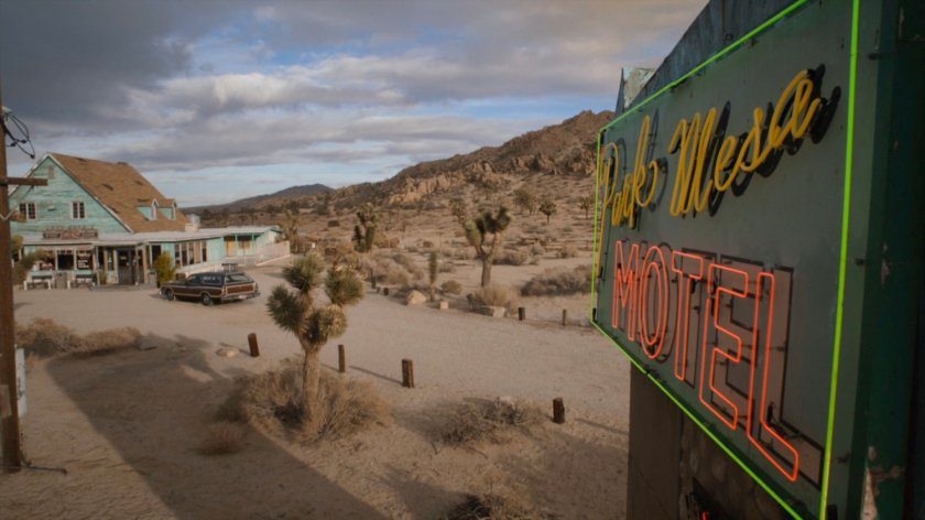 Station wagon pulling up to the Park Mesa Motel.