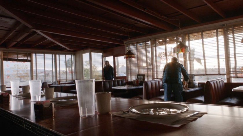 Shockley entering Park Mesa Motel diner.