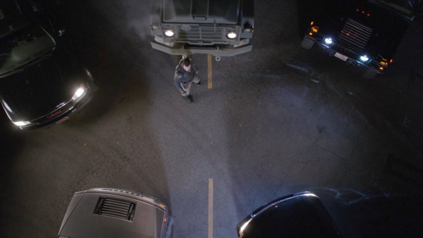 Director Mace surrounded by Watchdog vehicles on desert highway.