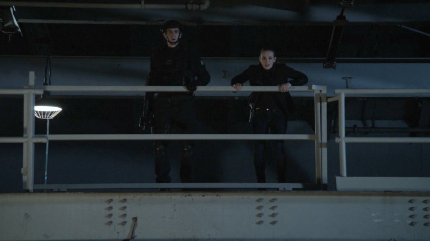 Agent Davis and Simmons looking over railing in old SVR base.