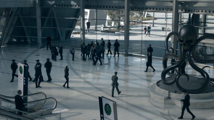 People walking through the atrium of the Framework Triskelion.