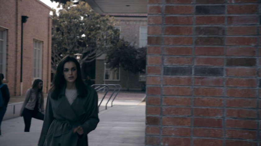 Jemma walking through a High School quad in the Framework.