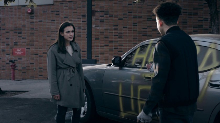 Jemma and Burnell in a High School parking lot in the Framework.