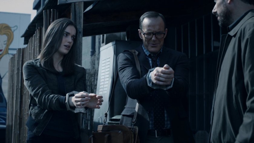 Jemma and Coulson in handcuffs in an alley in the Framework.