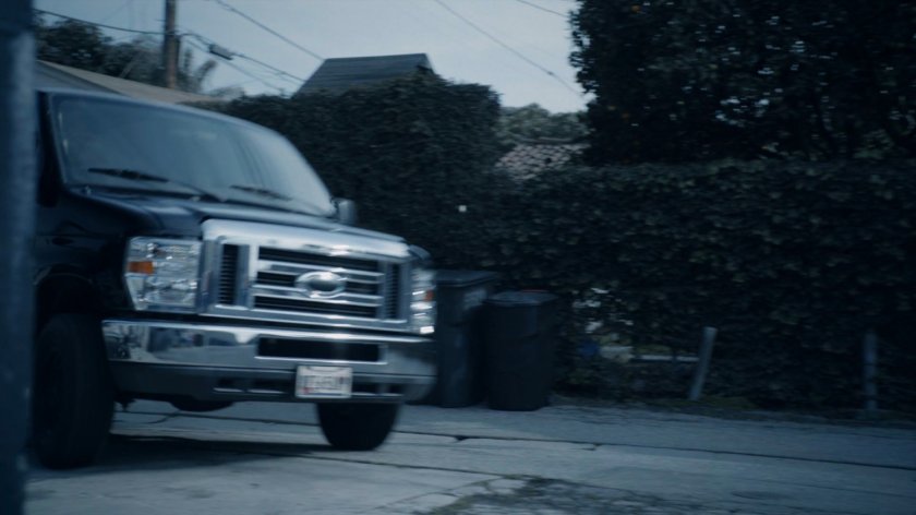 A van pulling into an alley in the Framework.