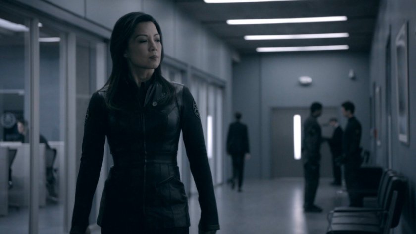 May in the hallway outside the bullpen of the Framework Triskelion.