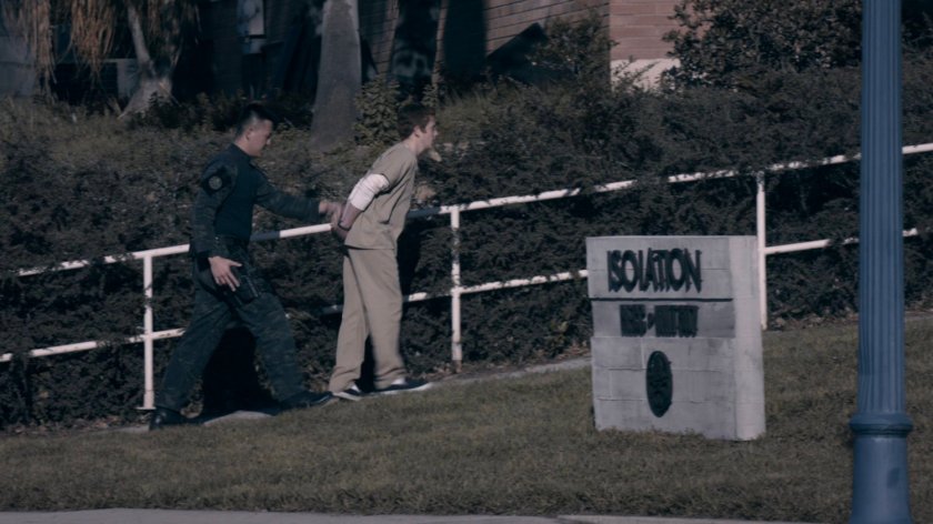 View of guard walking Chris into the HYDRA Enlightenment Cultivation Center Isolation Unit in the Framework.