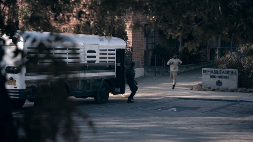 Tripp runs towards the bus outside the HYDRA Enlightenment Cultivation Center Rehabilitation Unit in the Framework.