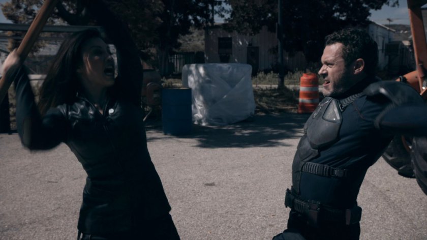 May fights the Patriot in a lot at the HYDRA Enlightenment Cultivation Center in the Framework.