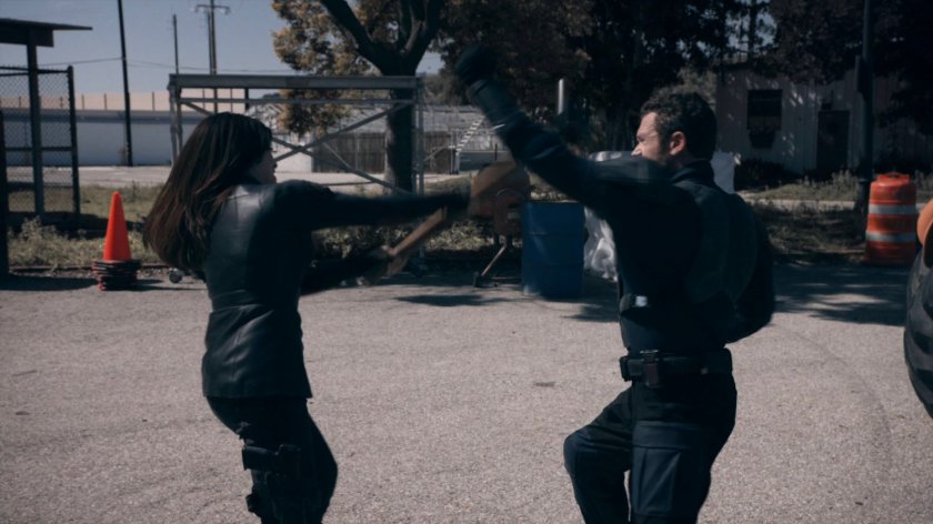 May fights the Patriot in a lot at the HYDRA Enlightenment Cultivation Center in the Framework.