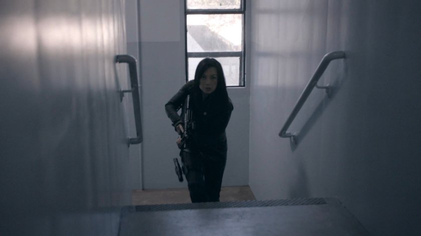 May in the stairway of the HYDRA Enlightenment Cultivation Center Isolation Unit in the Framework.