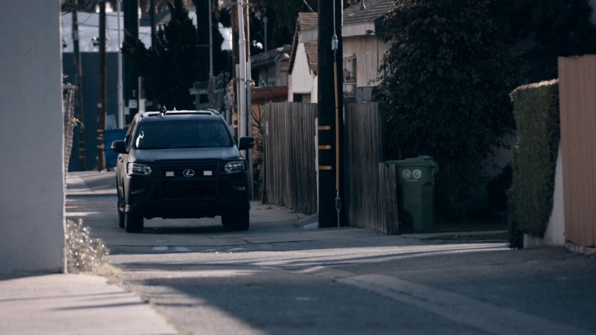 A HYDRA SUV in an alley outside a SHIELD safehouse in the Framework.
