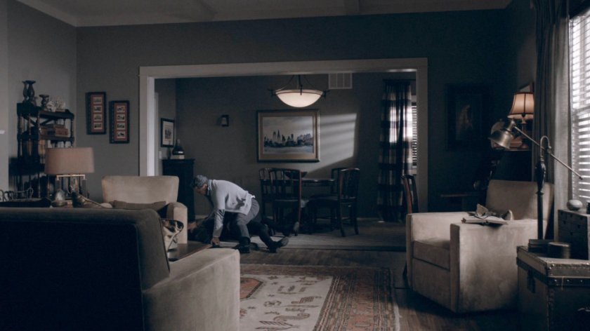 Alistair chokes Simmons in his house inside the Framework.