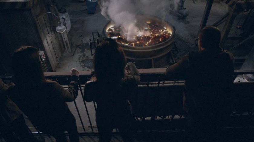 Jemma, Coulson, and May in a steel mill in the Framework.