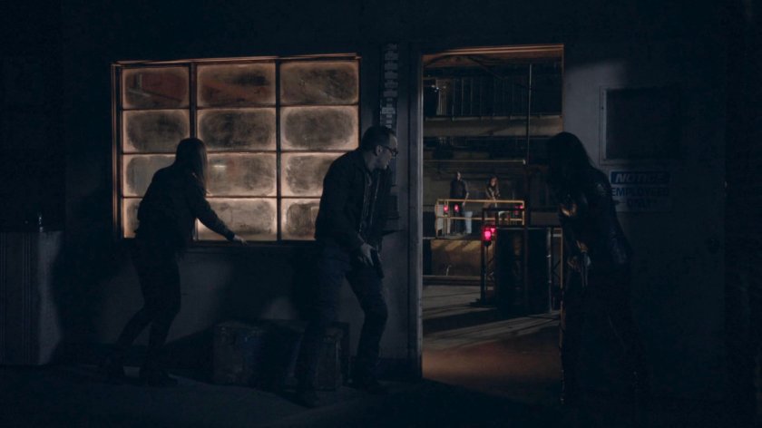 Simmons, Coulson, and May hide in a room in a steel mill in the Framework.