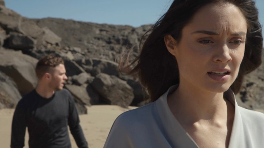 Fitz and Aida on a beach.