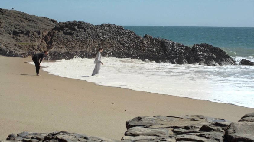 Fitz and Aida on a beach.