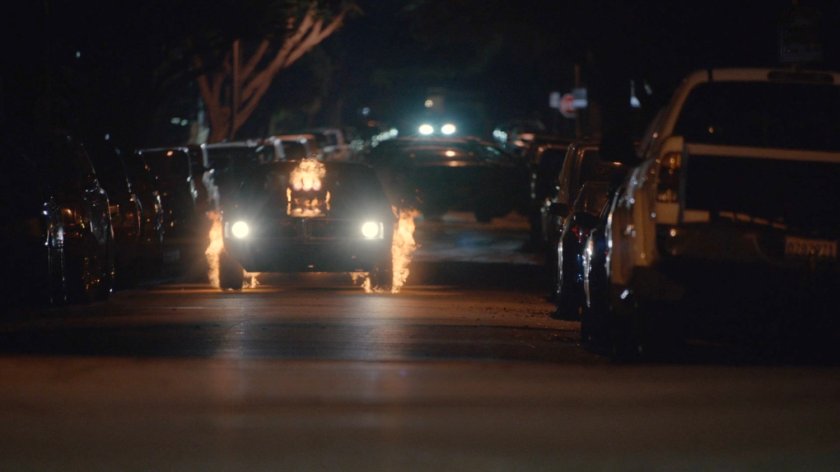 Flaming hell Charger racing along a street in Delaware.
