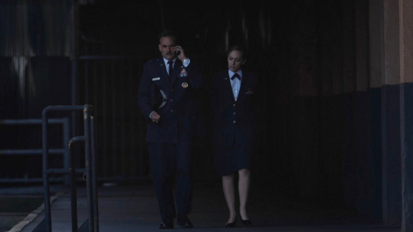 General Talbot on the phone and Lt Evans walking next to him.