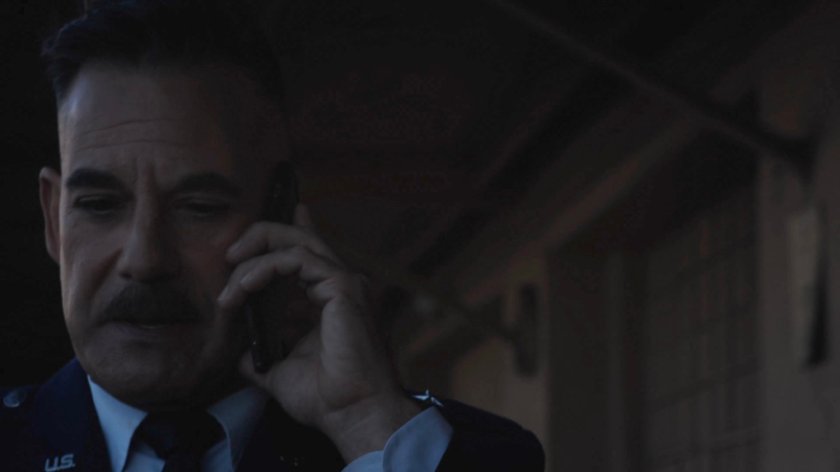 General Talbot on the phone and Lt Evans walking next to him.