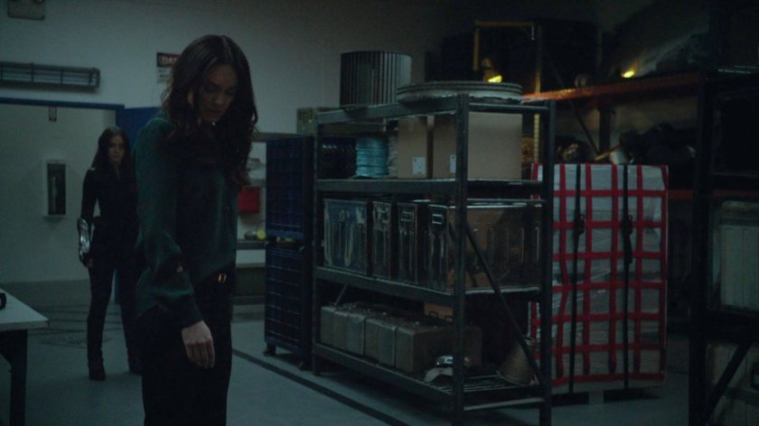 Daisy confronts Aida and Daisy in a storage room.