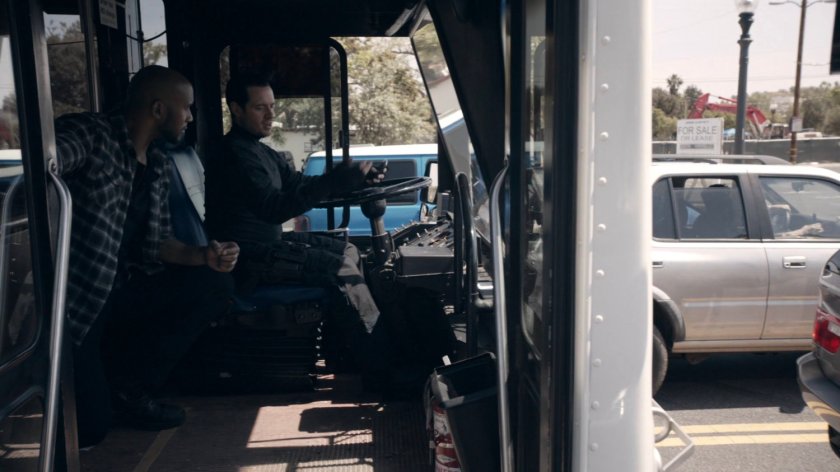 Burroughs and Mack on a midtown transit bus stuck in traffic in the Framework.