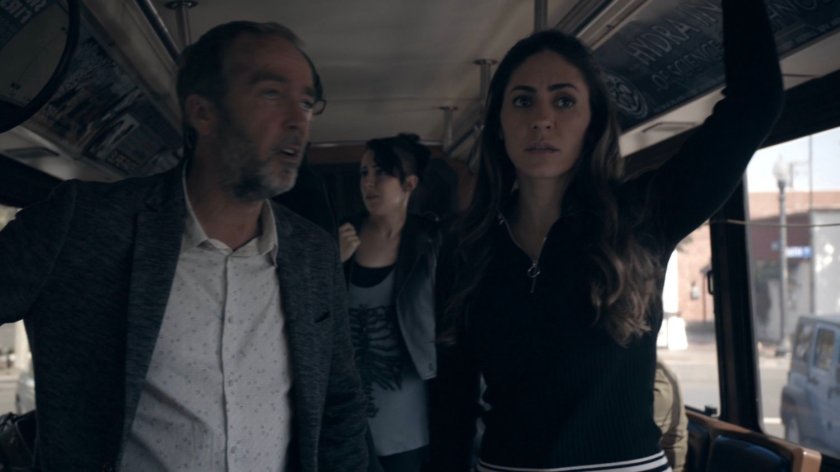 Radcliffe and Yo-Yo on a midtown transit bus stuck in traffic in the Framework.