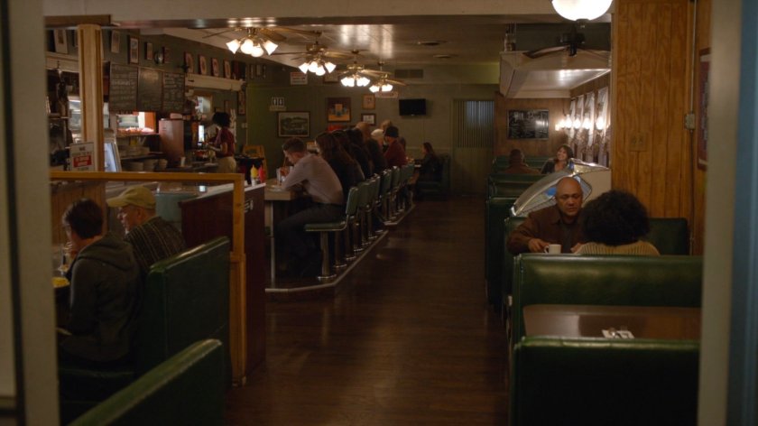 The Agents of SHIELD sitting at a counter in a diner.