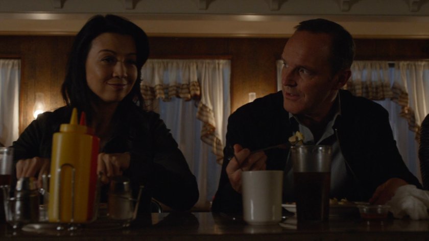 May and Coulson sitting at a counter in a diner.