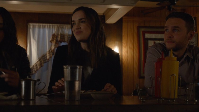 Simmons and Fitz sitting at a counter in a diner.
