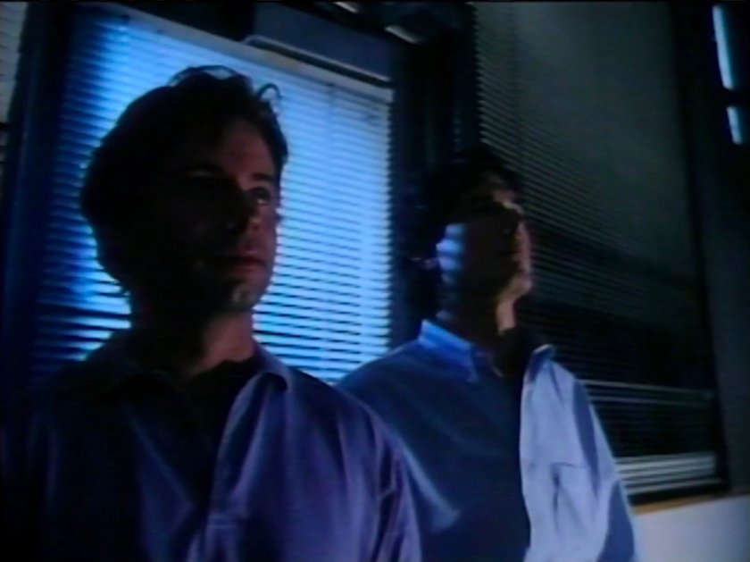 Reed and Victor in a dark college lab.