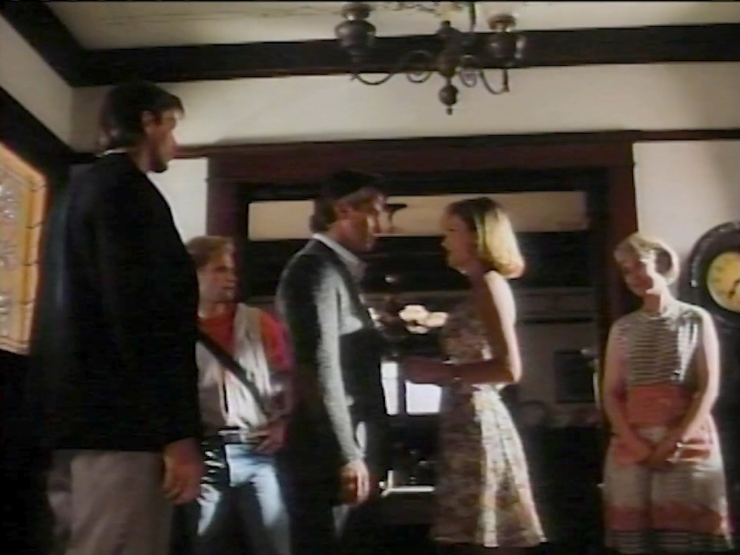 Johnny, Ben, Sue, and Reed in the foyer of Mrs Storm's Boarding House.