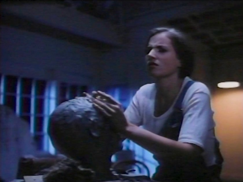 Alicia Masters sculpting a clay head in her loft.