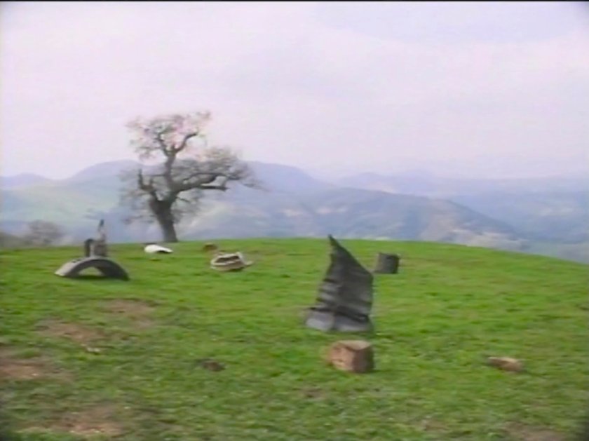 Crash wreckage on a one tree hill.