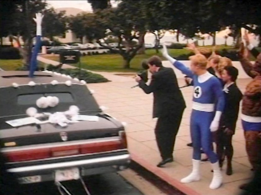 Johnny and The Thing waving at a departing limo after a wedding.