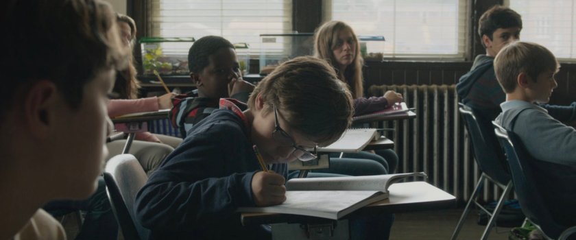 Young Reed and other students in an elementary classroom.