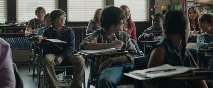 Young Reed and other students in an elementary classroom.