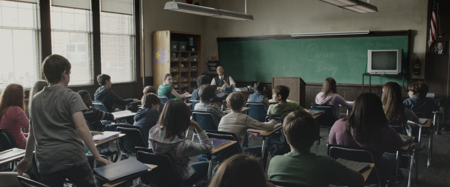 Young Ben and other students in an elementary classroom.