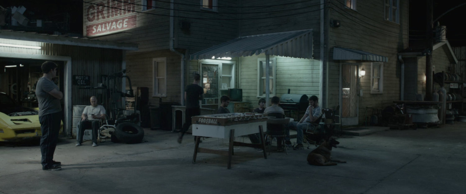 People hanging outside Grimm Salvage yard.