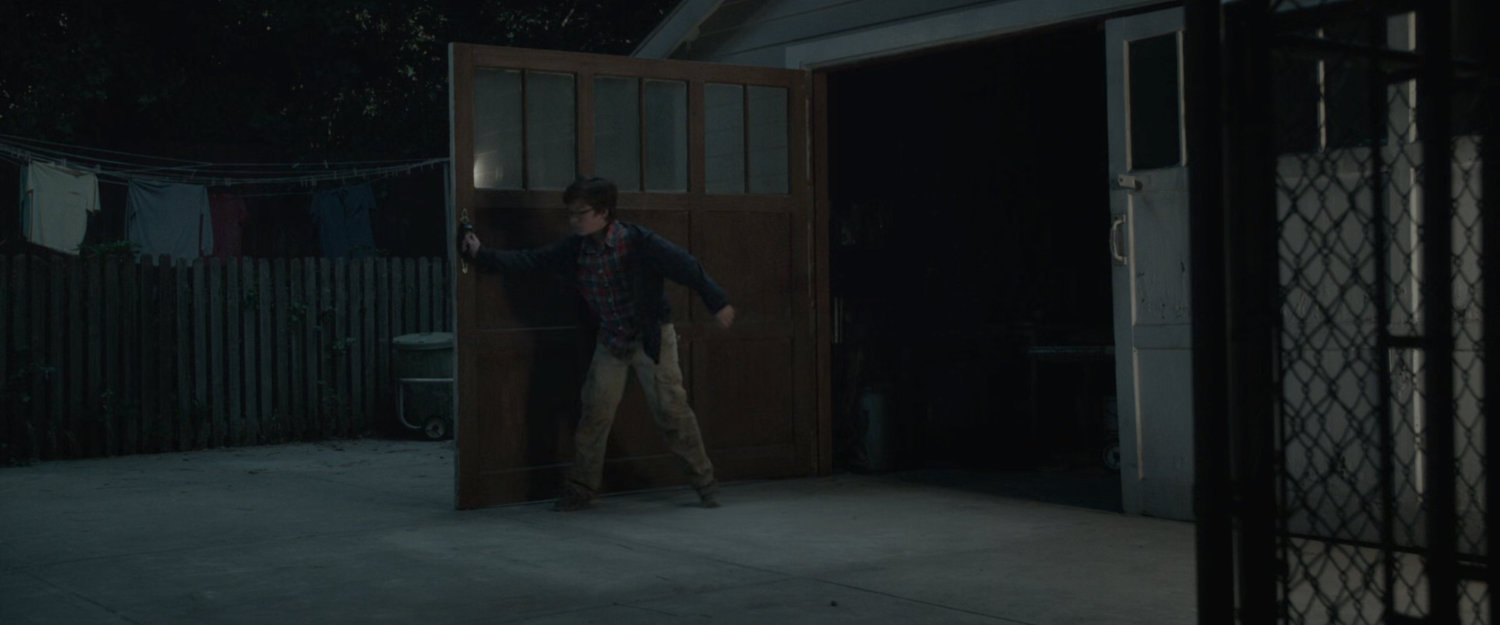 Young Ben and Reed outside of the Richards' garage.