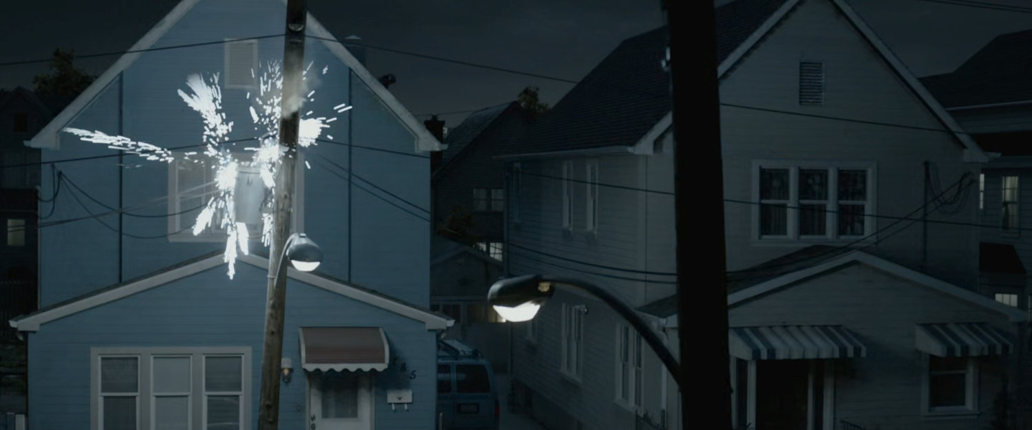 Electrical pole sparking outside the Richards' house.