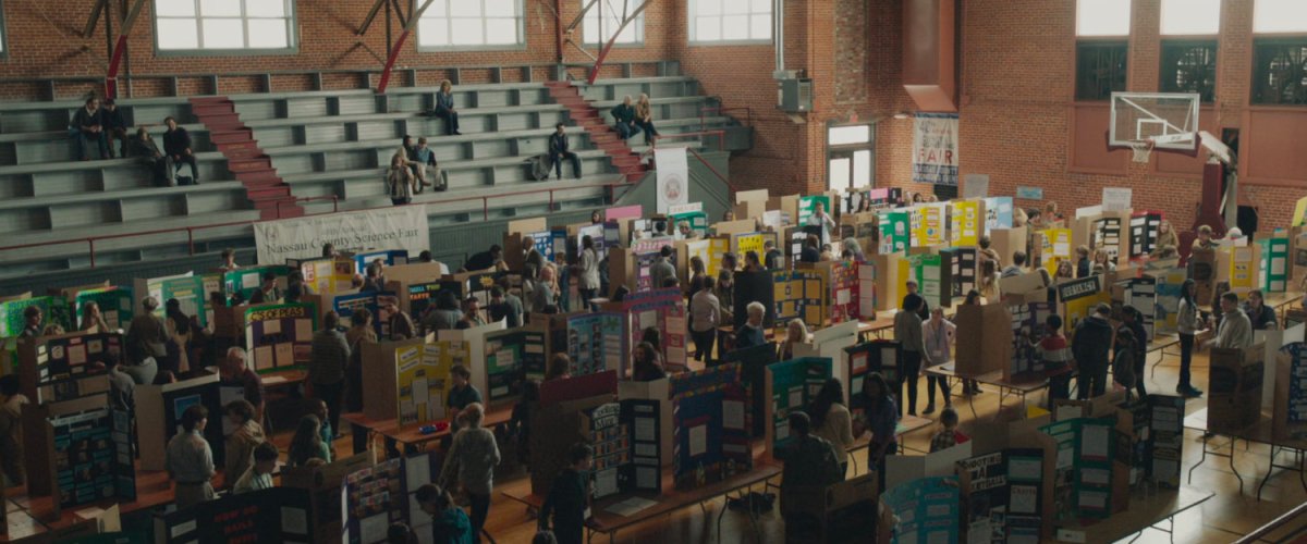 Students in school gymnasium hosting the Nassau County Science Fair.