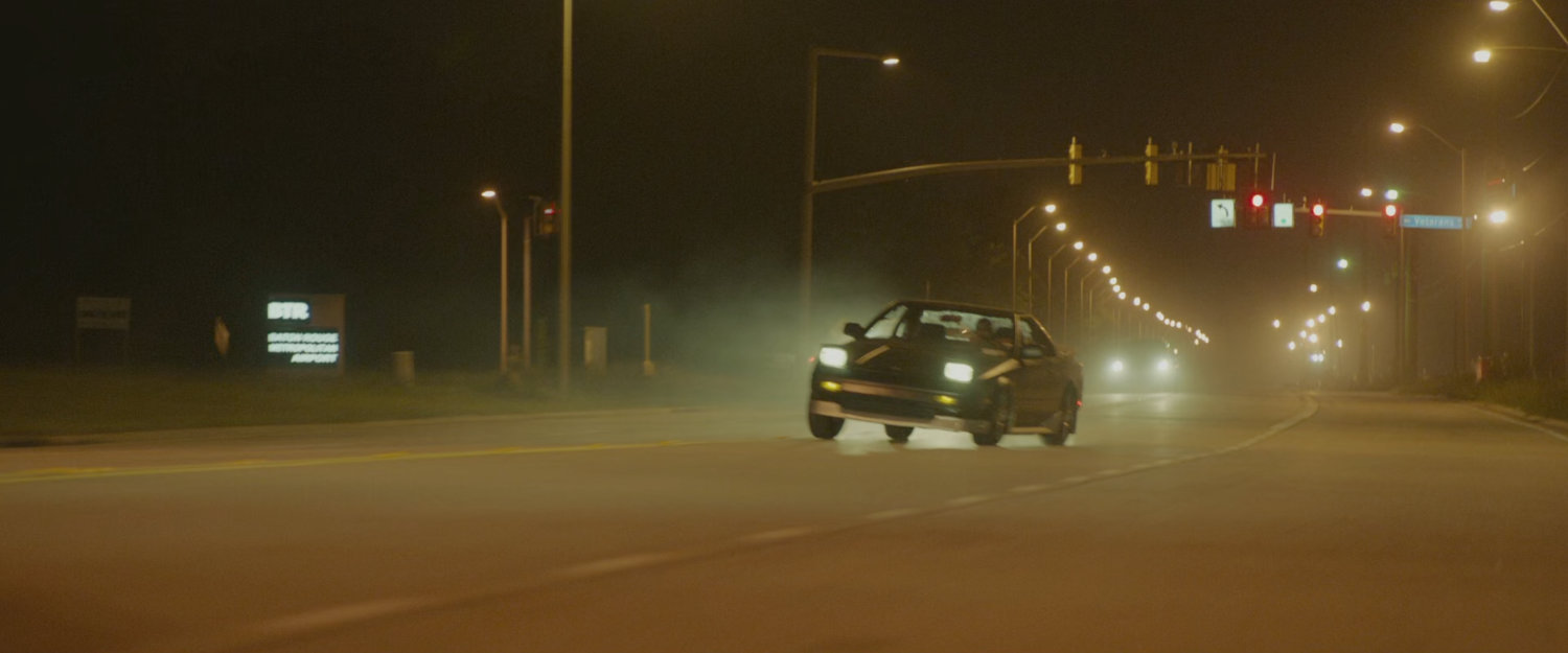 Car racing on street.