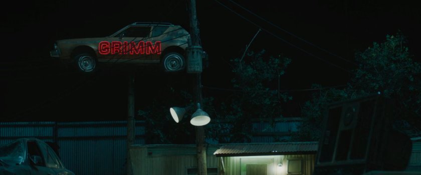 Outside Grimm Salvage at night.