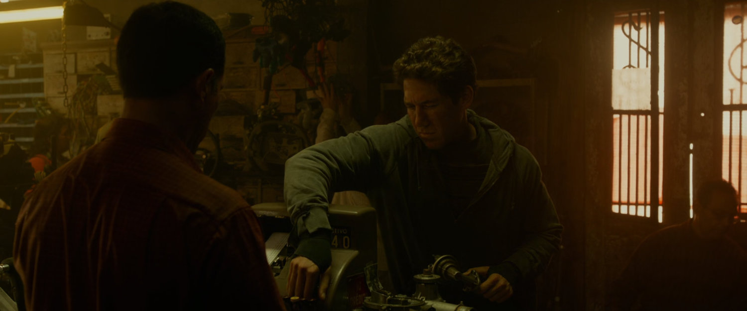 Reed, in disguise, in a South American junk shop.